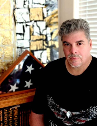 paul romero in a black patriot shirt for governor